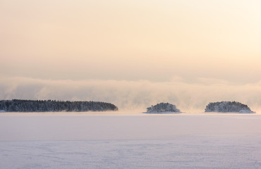 Blustery snow storm is coming from sea to frozen bay