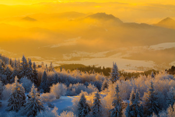 Fototapeta na wymiar Mountain valley panorama during sunrise. Beautiful natural panoramic landscape in winter time.