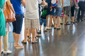 Closeup Queue of Asian people waiting at boarding gate at airport