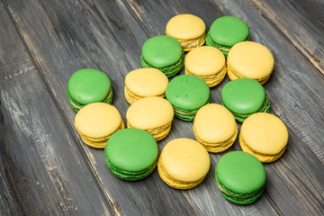 Heart laid out from macaroons on wooden table. Romantic declaration of love. Valentine's Day
