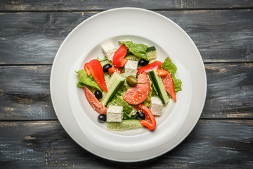 top view of a mixed vegetable salad on ceramic plate