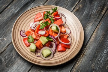 top view of a mixed vegetable salad on ceramic plate