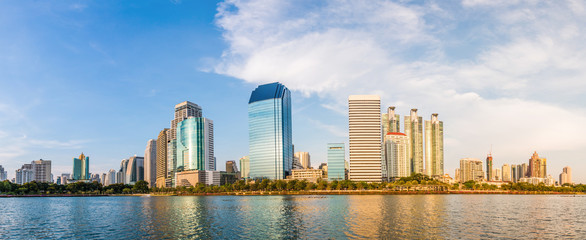 panorama modern building under the blue sky and cloudy with refl