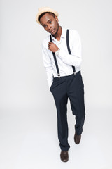 Attractive african man wearing hat posing