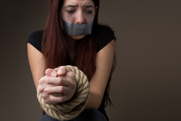 Unhappy woman with sealed mouth