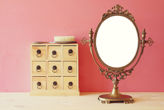 Old vintage oval mirror and woman toilet table