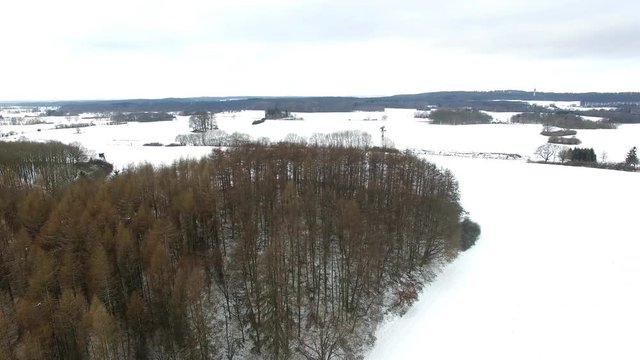 aerial view fly over winter forrest landscape in germany - dronen flight