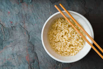 Soup Ramen noodles in ceramic bowl and bamboo sticks