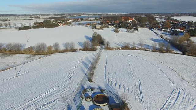 aerial view fly over snowy landscape with blue sky in germany - dronen flight