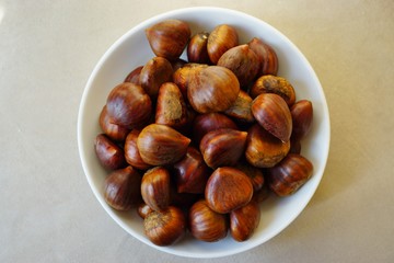 Bowl of fresh Italian chestnuts in the shell in winter