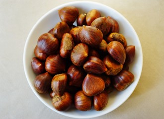 Bowl of fresh Italian chestnuts in the shell in winter