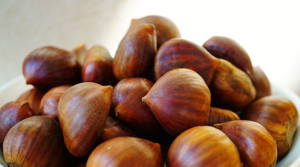 Bowl of fresh Italian chestnuts in the shell in winter