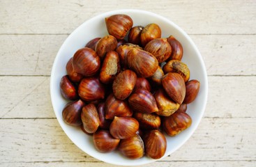 Bowl of fresh Italian chestnuts in the shell in winter