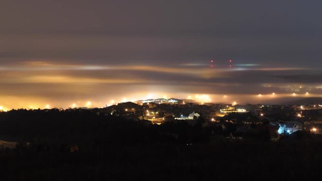 River of Fog Sweeps Around Rapid City at Night