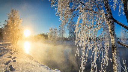 зимний утренний пейзаж с туманом на берегу реки и лесом, Россия, Урал - obrazy, fototapety, plakaty