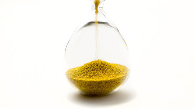 hourglass with gold beads on white background