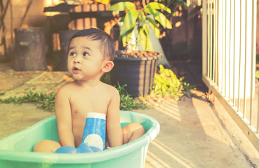 cute asian boy enjoy outdoor bathing