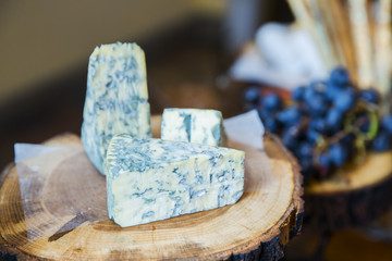 blue cheese on wooden table