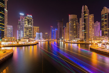 Fototapeta na wymiar Modern skyscrapers in luxury Dubai Marina with busy promenade in the evening,Dubai,United Arab Emirates
