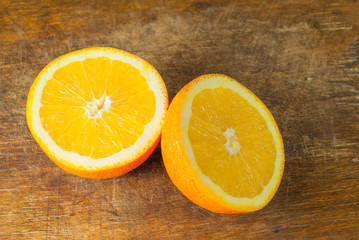 Oranges Fruits and Orange Slice on Wooden Table and Retro Fabric