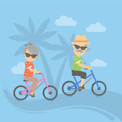 Isolated retired couple on vacation. Happy funny grandparents in sunglasses cycling on the exotic landscape.