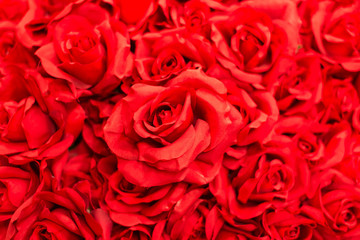 Bouquet red artificial roses for background.