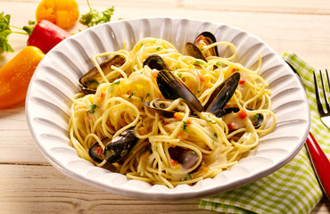 Plate full of pasta with steamed mussels