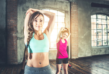 Fototapeta na wymiar Workout in a fitness gym