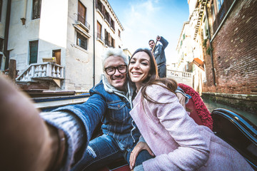 Couple sailing on venetian gondola © oneinchpunch