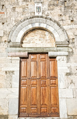 Fototapeta na wymiar Anagni (Frosinone, Lazio, Italy) - Wooden door of the medieval 