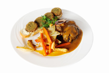 Ossobuco with falafel pumpkin on a white background