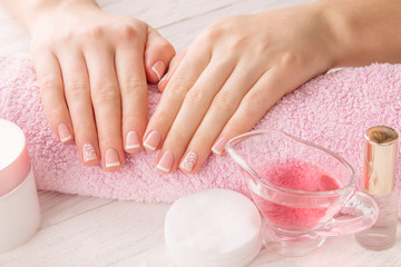 Naklejka premium Woman's hands with French manicure
