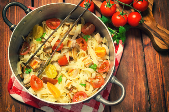 Homemade pasta with mushroom,chicken meat and vegetables