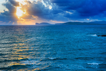 blue sea and yellow sky at sunset