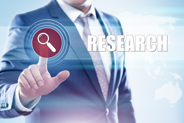 Businessman  pressing button on touch screen interface and select  research