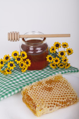 Honey in jar on a light background