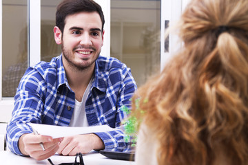 man of business in the office with the documents to the customer or employee