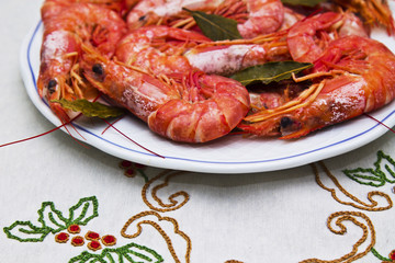 shrimp in the dish on flowered tablecloth