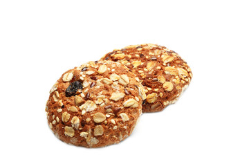 Cookies covered with nuts and raisins isolated on white background
