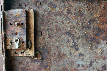 texture of rusty metal door with broken door lock