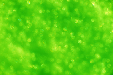 Fototapeta na wymiar Blurred green background with bokeh lights
