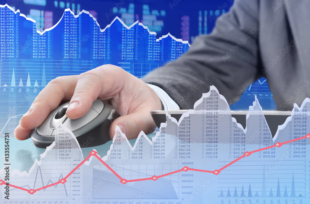 Leinwandbilder Man analyzing financial data and charts on computer 