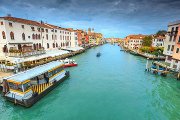 Spectacular canal with restaurant, hotels, boats in Venice, Italy, Europe