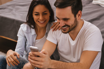 Couple looking at phone together