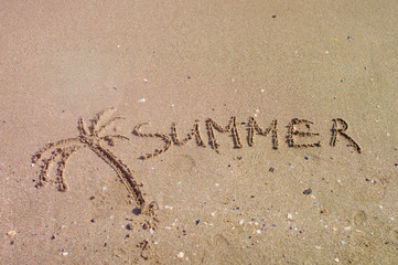 Handwritten inscription on sea sand, close up view