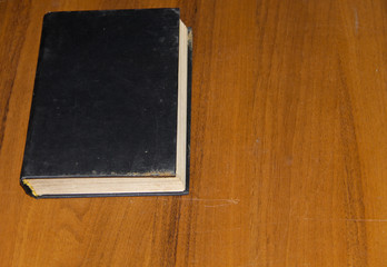Old book on wooden table