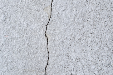 crack on the light wall texture close-up