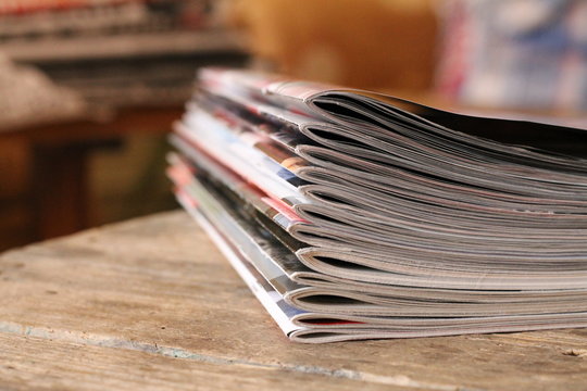 Magazines on the wooden table 