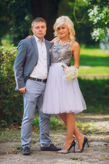 Beautiful young couple posing on wedding ceremony