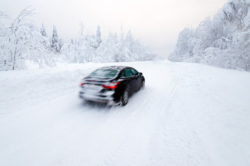 The car goes on the road in winter © Andrey Oleshko